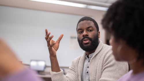 man speaking in classroom