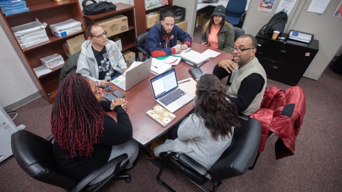 criminal justice students sitting around a table talking