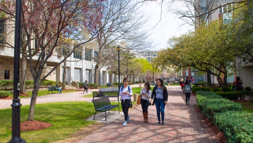 students walking along campus