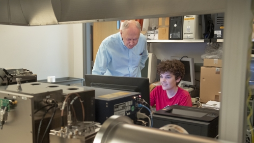 (l. to r.)Dr. Roman Brukh, Mass Spectrometry Facility Manager works with James McQuade (GSN '23) on the Fourier Transform Mass Spectrometer in the Life Science Center on the Newark campus.