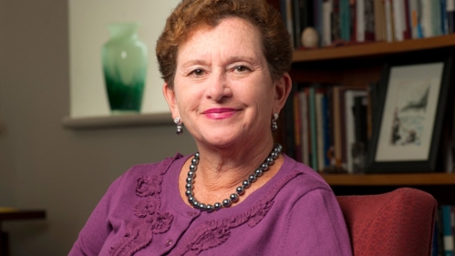 chancellor cantor in a purple cardigan