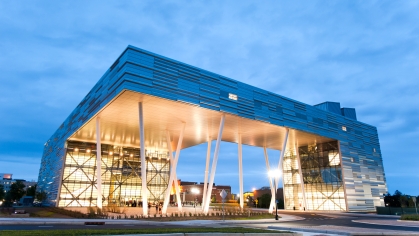 exterior of new brunswick business school building at twilight