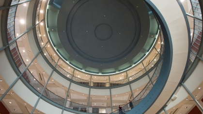 view of building ceiling and spiral staircase