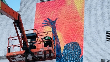 mural celebrating womanhood being erected