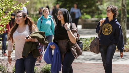 girls walking on campus