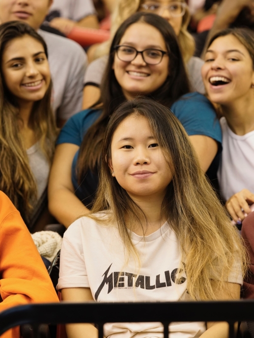 group of students sitting in risers