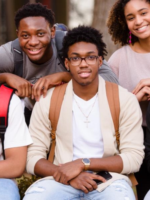 a multiracial group of students posing for a photo