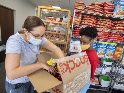 masked volunteers at food bank