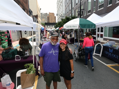 man and woman smiling at newark street fair