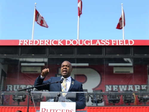 speaker at podium in fredrick douglass field