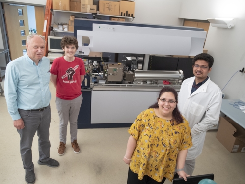 ) Dr. Roman Brukh, Mass Spectrometry Facility Manager, with graduate students James McQuade (GSN '23), Shruti Masand (GSN '22) and Ashutosh Sahoo (GSN '25) in the Life Science Center on the Newark campus